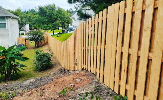 uneven-wooden-backyard-fence